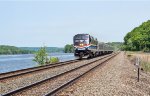 AMTK 706 passing milepost 119 along the Hudson River in Stockport